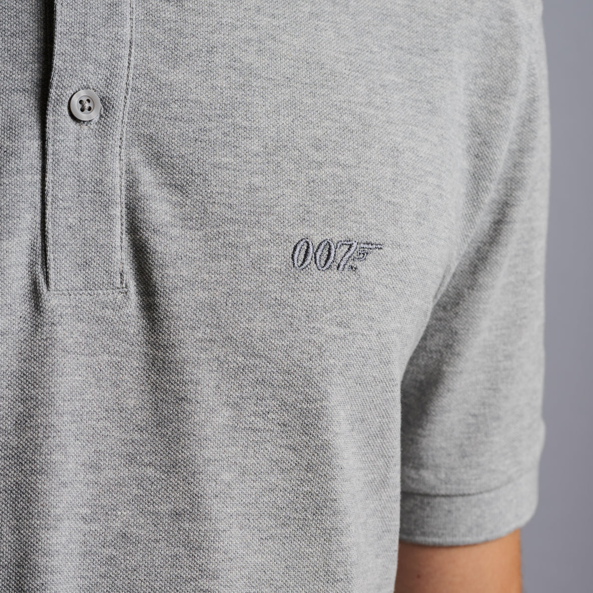 Grau meliertes Poloshirt aus Baumwolle mit James Bond-Stickerei „007“